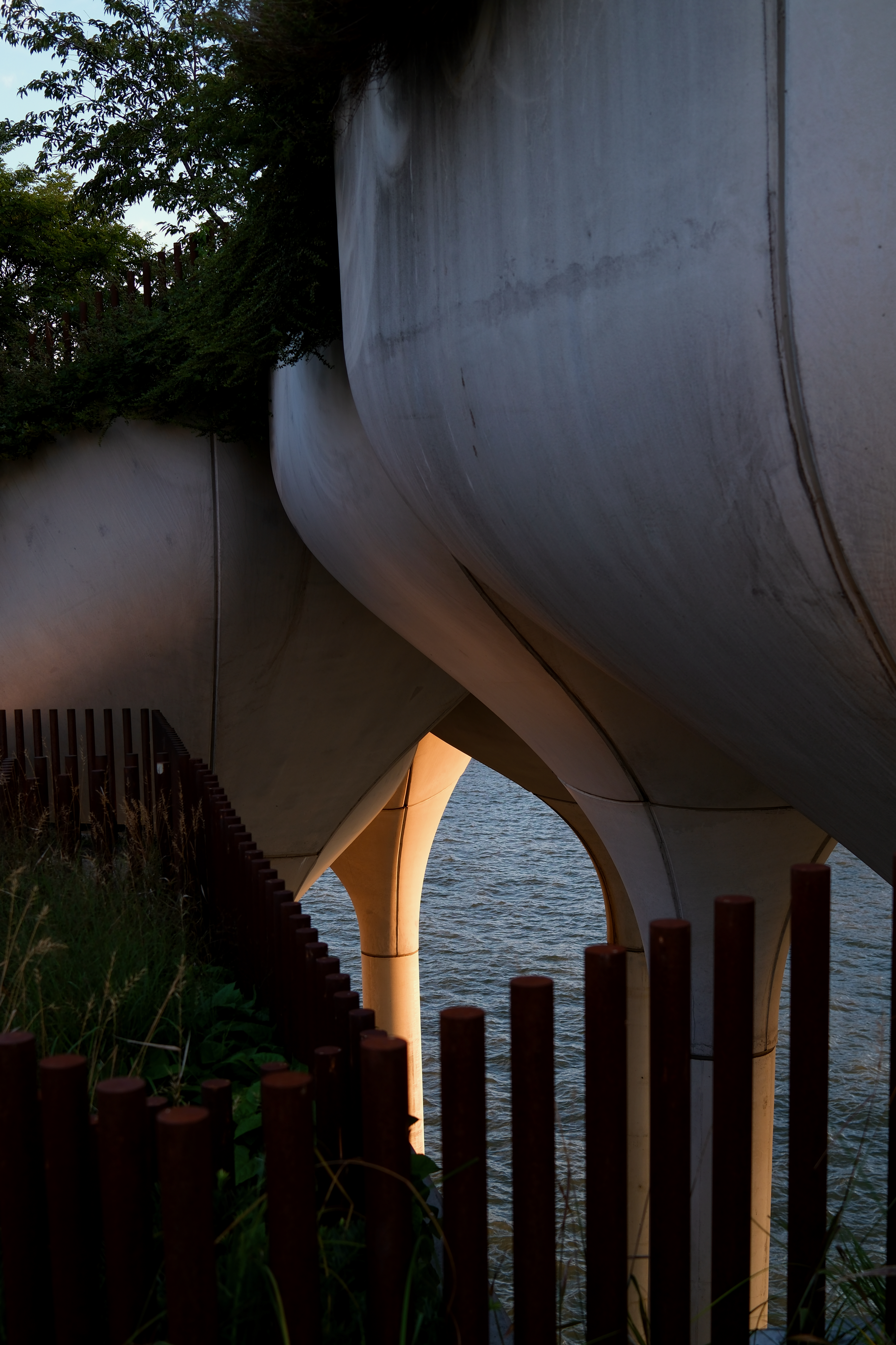 Traditional houseboat on still waters in soft golden light
